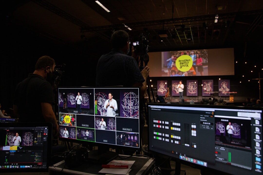 Professional broadcast training session with students learning video editing